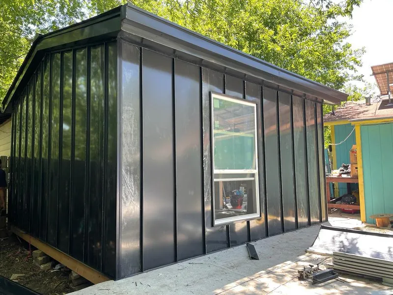 Black standing seam metal wall panels for Roof Inspection in Westwego